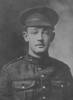 Black and white photo of a young man in military uniform.
