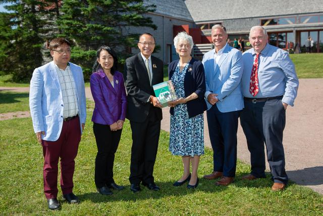 Varavadi Monaghan and guests attending book presentation in Cavendish, PEI.