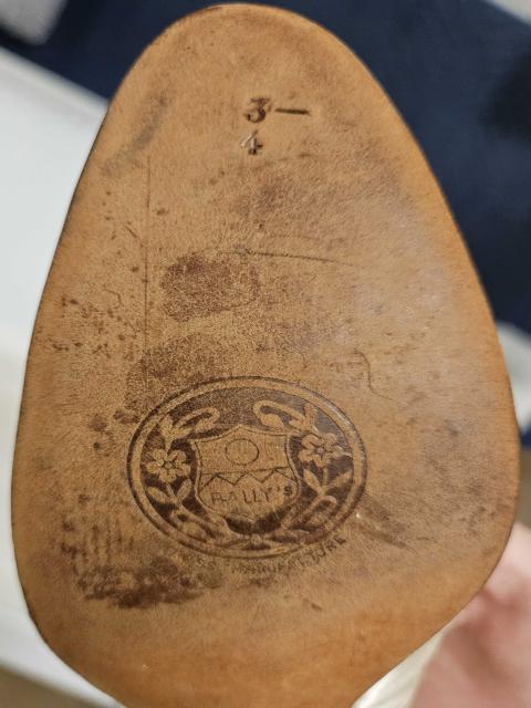 Sole of Montgomery’s ivory-coloured silk wedding slipper with “Bally’s Swiss Manufacture” and size “3–4” stamped on the leather.