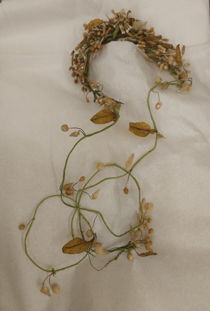 Wax and wire orange-blossom coronet worn over Montgomery’s original tulle veil, with flower buds and leaves.